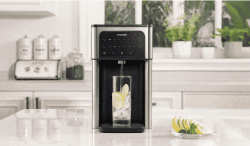 Philips ADD5980S Water Dispenser Pouring Cold Filtered Water with Lemon into Glass – Ideal Cold Water Cooler for Homes in Cyprus